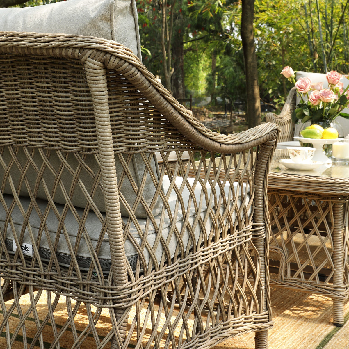 Close-up of the Willowbrook rattan weave and curved armrest