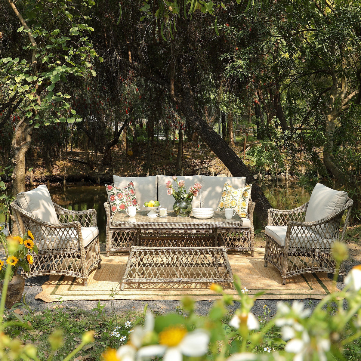 Willowbrook rattan garden sofa set arranged on a patio with rising coffee table