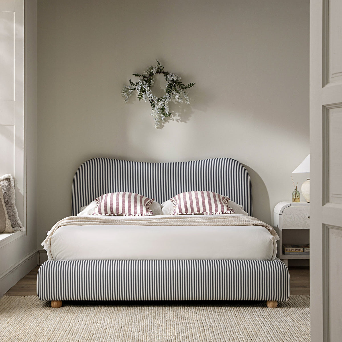 Egerie Curved Headboard Ottoman Storage Bed in Slate Blue Striped Fabric