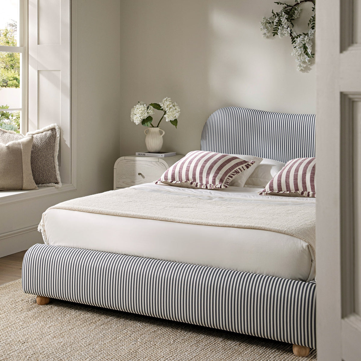 Egerie Curved Headboard Ottoman Storage Bed in Slate Blue Striped Fabric