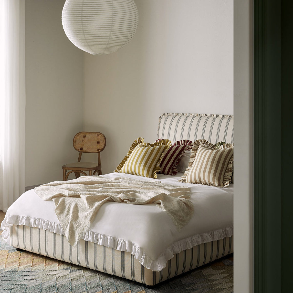 Celeste Upholstered Storage Bed with Ruffled Headboard in Laurel Green Stripe