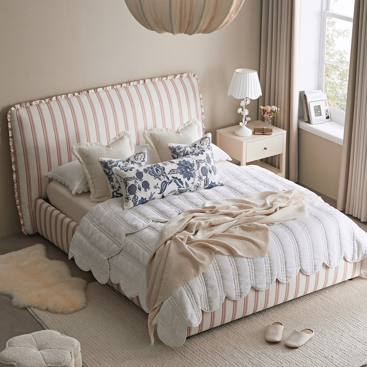 Celeste Upholstered Storage Bed with Ruffled Headboard in Peony Red Stripe