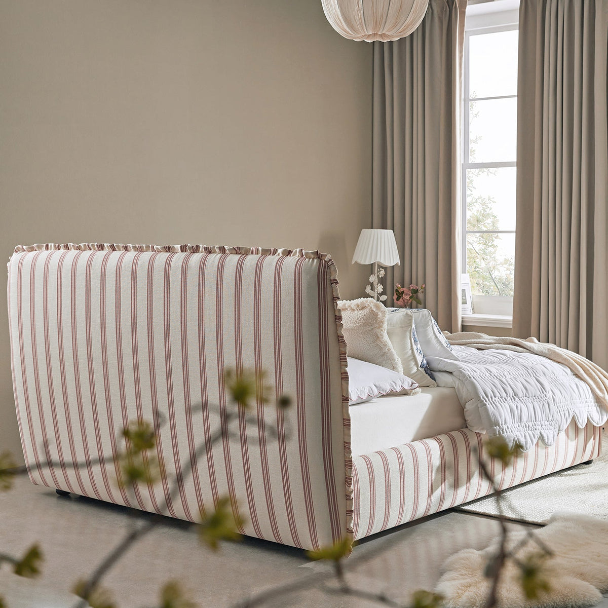 Celeste Upholstered Storage Bed with Ruffled Headboard in Peony Red Stripe