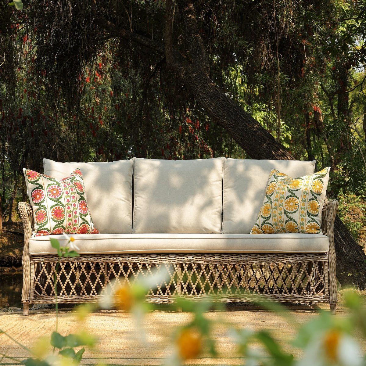 Willowbrook three-seater rattan garden sofa with lattice weave detail